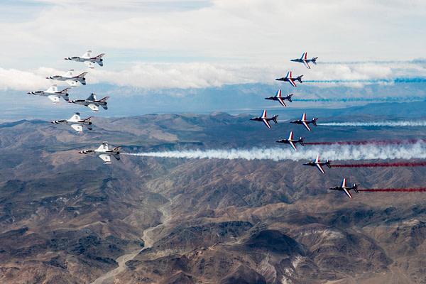 US Air Force Thunderbirds And Patrouille de France Fly Together Over Nevada
